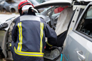 injured victims are rescued in car crash by firefighters